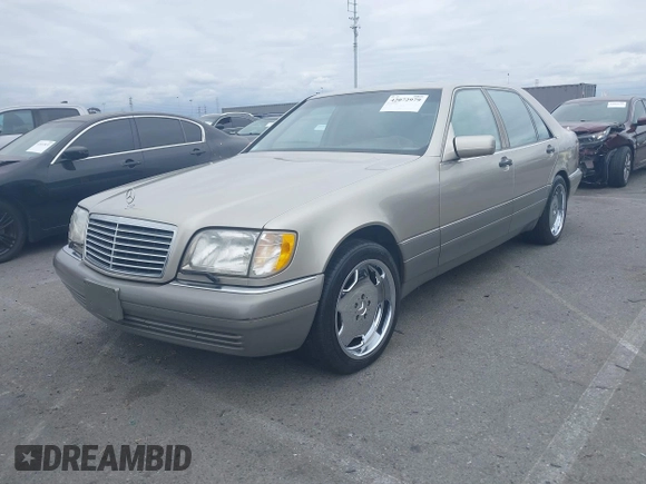 1996 Mercedes-Benz S with VIN WDBGA57E8TA318326, listed as a IAAI auction lot 42072979 with 97,504 mi miles and . Bid and sale history available at DreamBid. Image 2.