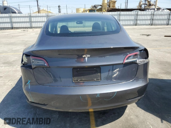2023 Tesla Model 3 with VIN 5YJ3E1EA3PF695267, listed as a Copart auction lot 52559645 with 9,025 mi miles and Salvage title. Bid and sale history available at DreamBid. Image 6.