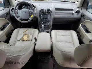 2008 Ford Taurus X SEL z VIN 1FMDK02W68GA43723, wystawiony jako Copart lot #56650305 z przebiegiem 279 439 mil mil oraz Czysty tytuł • Clean title. Historia ofert i sprzedaży dostępna na DreamBid. Obrazek 8.