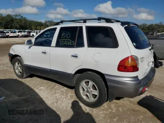 2001 Hyundai Santa Fe GLS with VIN KM8SC83D91U048535, listed as a Copart auction lot 85041184 with 218,621 mi miles and Salvage Title. Bid and sale history available at carsss.com. Image 2.
