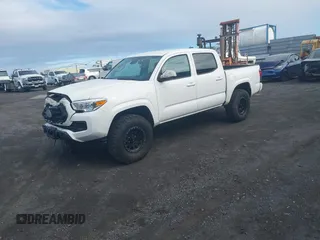 2023 Toyota Tacoma SR with VIN 3TYCZ5AN4PT168312, listed as a IAAI auction lot 42555775 with 8,288 mi miles and . Bid and sale history available at DreamBid. Image 2.