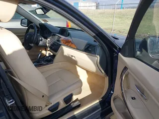 2013 BMW 3 Series 320i with VIN WBA3B1C58DK129051, listed as a IAAI auction lot 41119380 with 101,427 mi miles. Bid and sale history available at carsss.com. Image 5.