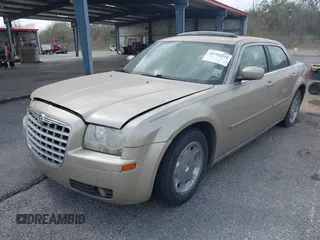 2006 Chrysler 300 Touring with VIN 2C3KA53G56H309497, listed as a IAAI auction lot 41792324 with 128,492 mi miles. Bid and sale history available at carsss.com. Image 2.