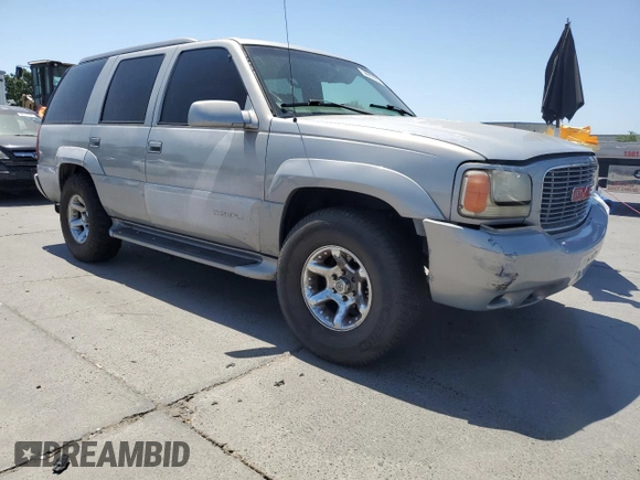 1999 GMC Denali z VIN 1GKEK13R6XR914411, wystawiony jako Copart lot #56063555 z przebiegiem 231 344 mil mil oraz Szkoda całkowita • Salvage title. Historia ofert i sprzedaży dostępna na DreamBid. Obrazek 4.