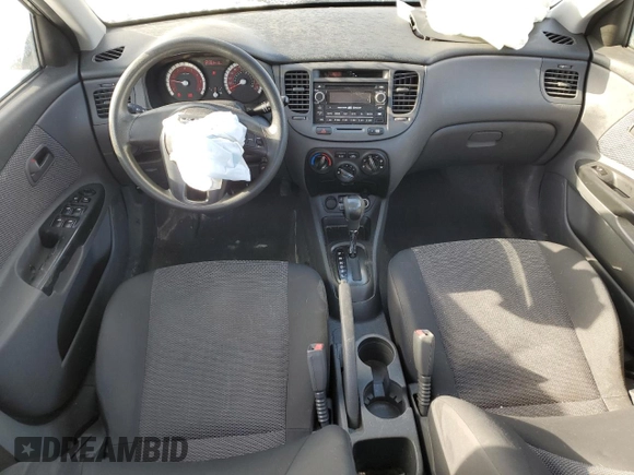 2011 Kia Rio with VIN KNADH4B32B6915325, listed as a Copart auction lot 86824074 with 167,410 mi miles and Salvage Title. Bid and sale history available at DreamBid. Image 8.