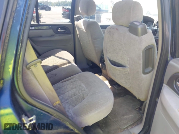 2004 GMC Envoy SLE with VIN 1GKDT13S242391968, listed as a IAAI auction lot 42079420 with 234,611 mi miles. Bid and sale history available at carsss.com. Image 8.
