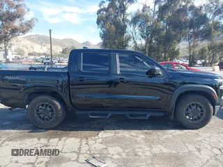 2023 Nissan Frontier Pro-X with VIN 1N6ED1EJ6PN619651, listed as a IAAI auction lot 41838415 with 69,819 mi miles and . Bid and sale history available at DreamBid. Image 14.