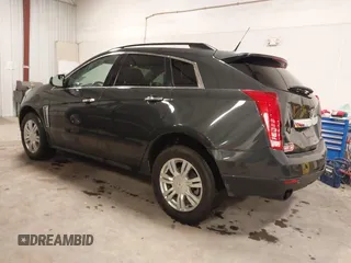 2014 Cadillac SRX with VIN 3GYFNAE34ES665630, listed as a IAAI auction lot 41315281 with 99,009 mi miles and . Bid and sale history available at DreamBid. Image 3.