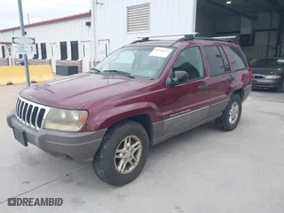 2003 Jeep Grand Cherokee Laredo with VIN 1J4GW48S83C563627, listed as a IAAI auction lot 41910225 with 150,264 mi miles. Bid and sale history available at carsss.com. Image 2.