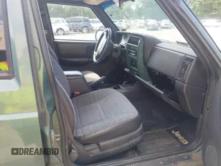2000 Jeep Cherokee with VIN 1J4FF48S8YL242593, listed as a IAAI auction lot 42577724 with 127,138 mi miles and . Bid and sale history available at DreamBid. Image 5.