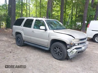 2005 Chevrolet Tahoe LS z VIN 1GNEK13T45J167997, wystawiony jako IAAI lot #42298160 z przebiegiem 142 981 mil mil oraz . Historia ofert i sprzedaży dostępna na DreamBid. Obrazek 1.