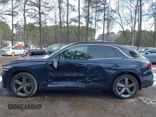 2022 Genesis GV70 Sport z VIN KMUMCDTC3NU074029, wystawiony jako IAAI lot #41400987 z przebiegiem 29 494 mil mil oraz . Historia ofert i sprzedaży dostępna na DreamBid. Obrazek 6.