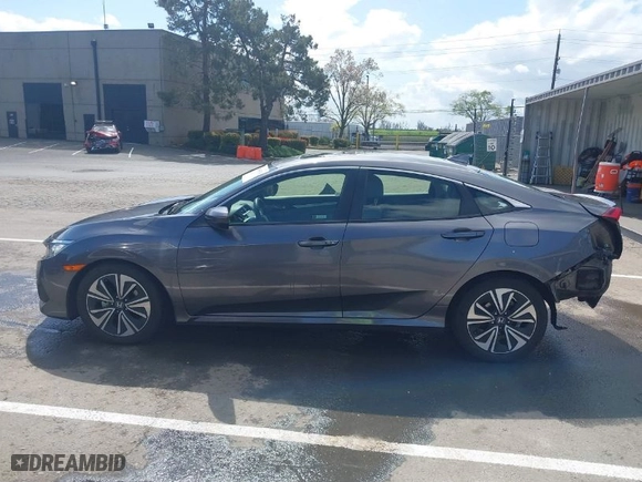 2018 Honda Civic Sedan EX-T with VIN JHMFC1F30JX018885, listed as a IAAI auction lot 41905534 with 94,560 mi miles. Bid and sale history available at carsss.com. Image 15.