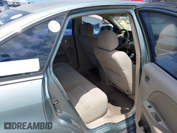 2005 Ford Five Hundred SEL z VIN 1FAFP241X5G118341, wystawiony jako IAAI lot #42012730 z przebiegiem Nie podano mil oraz . Historia ofert i sprzedaży dostępna na DreamBid. Obrazek 8.