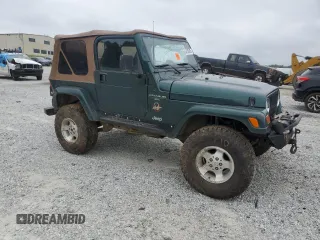 1999 Jeep Wrangler Sahara with VIN 1J4FY49S0XP489462, listed as a Copart auction lot 54750405 with 134,134 mi miles and Non repairable. Bid and sale history available at DreamBid. Image 4.