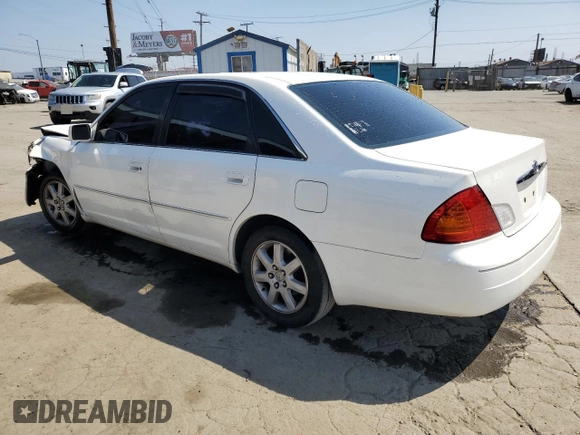 2000 Toyota Avalon XL with VIN 4T1BF28B9YU068001, listed as a Copart auction lot 54958915 with 240,232 mi miles and Salvage Title. Bid and sale history available at DreamBid. Image 2.