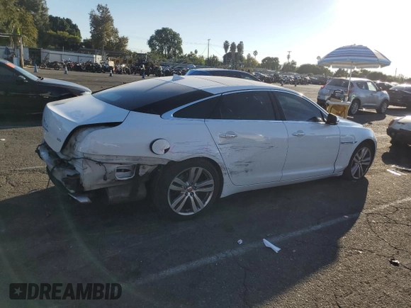 2014 Jaguar XJ with VIN SAJWA2GZ7E8V66626, listed as a Copart auction lot 78824254 with 132,720 mi miles and Salvage Title. Bid and sale history available at carsss.com. Image 3.