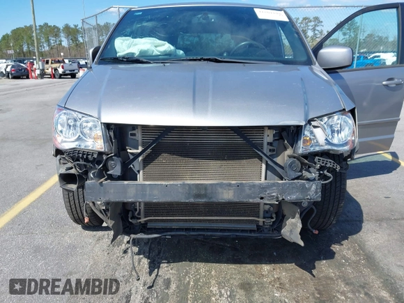 2014 Dodge Grand Caravan SXT with VIN 2C4RDGCGXER261467, listed as a IAAI auction lot 41801810 with 97,322 mi miles and . Bid and sale history available at DreamBid. Image 6.