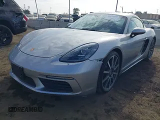 2021 Porsche Cayman with VIN WP0AA2A82MS260377, listed as a IAAI auction lot 40970360 with 23,785 mi miles and . Bid and sale history available at DreamBid. Image 2.