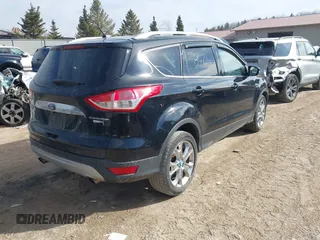 2016 Ford Escape Titanium with VIN 1FMCU9JX4GUB38303, listed as a IAAI auction lot 41788421 with 138,511 mi miles and . Bid and sale history available at DreamBid. Image 4.