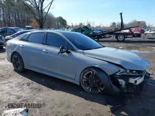 2023 Kia K5 GT-Line z VIN 5XXG64J28PG188506, wystawiony jako IAAI lot #41854184 z przebiegiem 18 967 mil mil oraz . Historia ofert i sprzedaży dostępna na DreamBid. Obrazek 1.