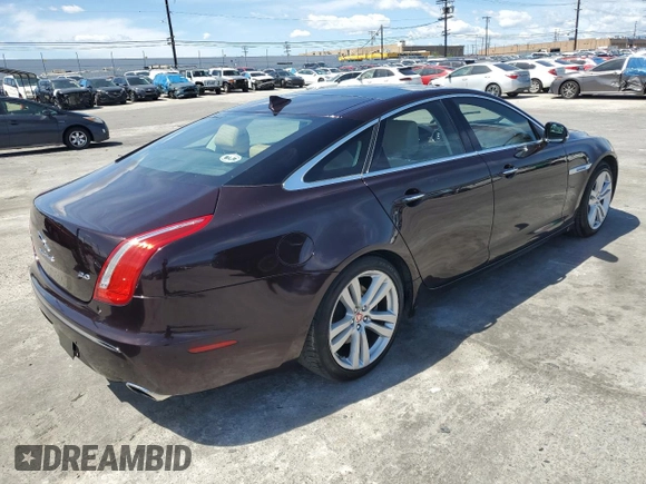 2014 Jaguar XJ with VIN SAJWA1CZ3E8V69877, listed as a Copart auction lot 51520405 with 57,567 mi miles and Clean Title. Bid and sale history available at DreamBid. Image 3.