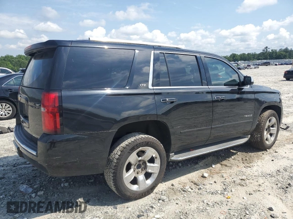 2015 Chevrolet Tahoe LTZ with VIN 1GNSCCKC2FR693500, listed as a Copart auction lot 60225195 with 206,210 mi miles and Salvage title. Bid and sale history available at DreamBid. Image 3.