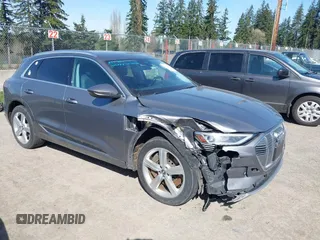 2019 Audi e-tron Premium Plus with VIN WA1LAAGE4KB012574, listed as a IAAI auction lot 41916641 with 104,911 mi miles. Bid and sale history available at carsss.com. Image 1.