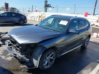 2014 BMW X1 xDrive28i with VIN WBAVL1C57EVY23722, listed as a IAAI auction lot 41839543 with 121,742 mi miles. Bid and sale history available at carsss.com. Image 19.