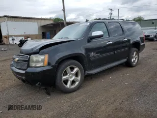 2011 Chevrolet Suburban with VIN 1GNSKHE36BR382223, listed as a Copart auction lot 64559285 with 140,819 mi miles and Salvage title. Bid and sale history available at DreamBid. Image 1.