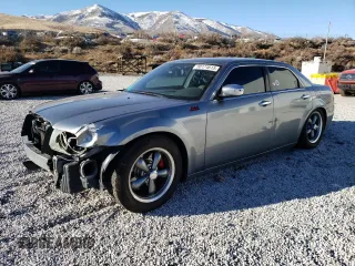 2007 Chrysler 300 C with VIN 2C3LA63H67H706530, listed as a Copart auction lot 88174615 with 104,505 mi miles and Salvage Title. Bid and sale history available at carsss.com. Image 1.