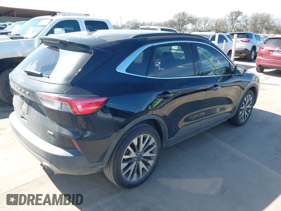 2020 Ford Escape Titanium Hybrid with VIN 1FMCU0DZ9LUC08090, listed as a IAAI auction lot 41674697 with 43,586 mi miles and . Bid and sale history available at DreamBid. Image 4.