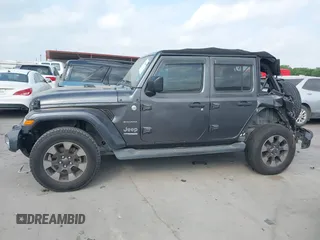 2018 Jeep Wrangler Unlimited Sahara z VIN 1C4HJXEG5JW194523, wystawiony jako IAAI lot #42056557 z przebiegiem 71 141 mil mil oraz . Historia ofert i sprzedaży dostępna na DreamBid. Obrazek 14.