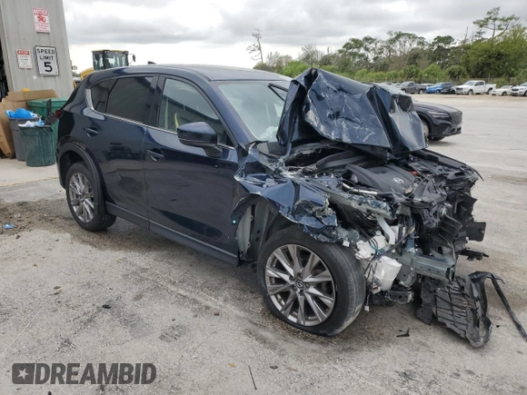 2021 Mazda CX-5 Grand Touring with VIN JM3KFADM9M0401778, listed as a Copart auction lot 46227515 with 44,587 mi miles and Non Repairable. Bid and sale history available at carsss.com. Image 4.