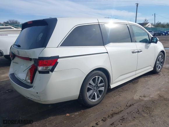 2015 Honda Odyssey Touring Elite with VIN 5FNRL5H9XFB121921, listed as a IAAI auction lot 41858551 with 61,506 mi miles. Bid and sale history available at carsss.com. Image 4.