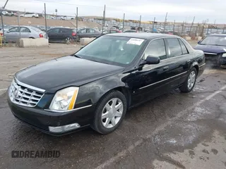 2006 Cadillac DTS w/1SC with VIN 1G6KD57Y96U251691, listed as a IAAI auction lot 41086147 with 128,959 mi miles. Bid and sale history available at carsss.com. Image 2.