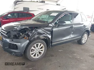 2014 Volkswagen Touareg Sport with VIN WVGEF9BP0ED015273, listed as a IAAI auction lot 42046823 with 84,694 mi miles and . Bid and sale history available at DreamBid. Image 6.