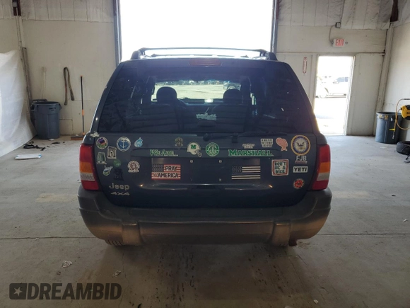 2004 Jeep Grand Cherokee Laredo z VIN 1J4GW48S14C338788, wystawiony jako Copart lot #53136715 z przebiegiem 150 352 mil mil oraz Szkoda całkowita • Salvage title. Historia ofert i sprzedaży dostępna na DreamBid. Obrazek 6.
