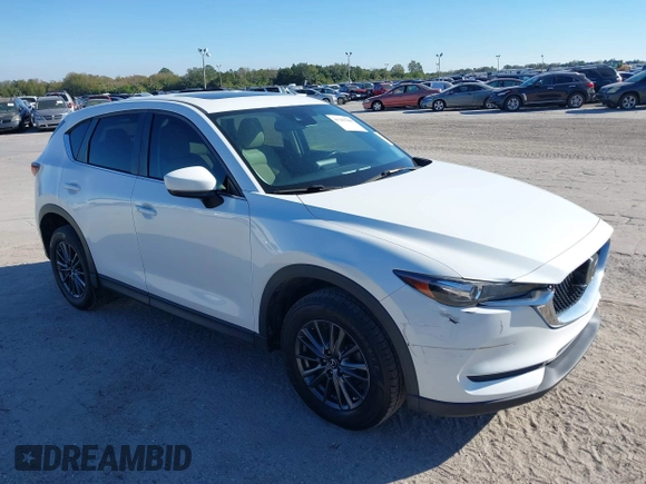 2020 Mazda CX-5 Touring with VIN JM3KFACM6L0737727, listed as a IAAI auction lot 41283200 with 85,949 mi miles and . Bid and sale history available at carsss.com. Image 1.