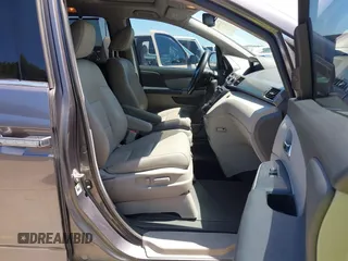 2015 Honda Odyssey Touring Elite z VIN 5FNRL5H99FB017517, wystawiony jako IAAI lot #42246066 z przebiegiem 104 878 mil mil oraz . Historia ofert i sprzedaży dostępna na DreamBid. Obrazek 5.
