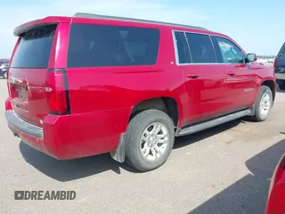 2015 Chevrolet Suburban LT with VIN 1GNSKJKC5FR726299, listed as a IAAI auction lot 42740904 with 96,700 mi miles and . Bid and sale history available at DreamBid. Image 4.