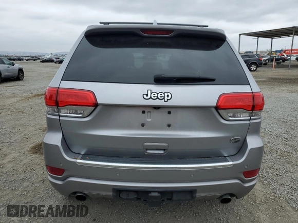 2015 Jeep Grand Cherokee Overland with VIN 1C4RJECG4FC808241, listed as a Copart auction lot 59699685 with 67,542 mi miles and Salvage title. Bid and sale history available at DreamBid. Image 6.