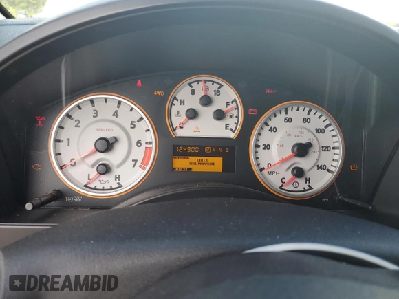 2012 Nissan Titan SV z VIN 1N6BA0EC2CN309207, wystawiony jako Copart lot #60451435 z przebiegiem 124 900 mil mil oraz Szkoda całkowita • Salvage title. Historia ofert i sprzedaży dostępna na DreamBid. Obrazek 9.