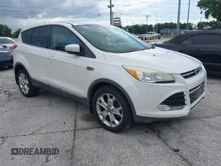 2013 Ford Escape SEL z VIN 1FMCU9HX5DUC33079, wystawiony jako IAAI lot #42521744 z przebiegiem 133 864 mil mil oraz . Historia ofert i sprzedaży dostępna na DreamBid. Obrazek 1.
