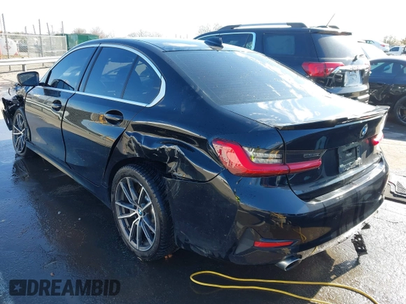 2020 BMW 3 Series 330i xDrive with VIN WBA5R7C06LFH40038, listed as a IAAI auction lot 41780401 with 100,588 mi miles. Bid and sale history available at carsss.com. Image 3.