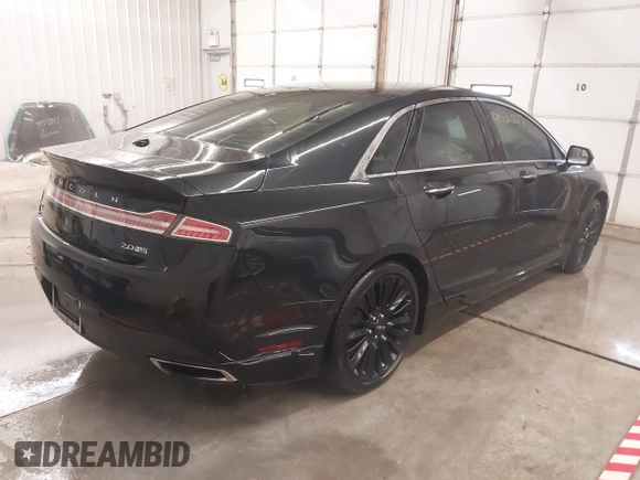 2015 Lincoln MKZ z VIN 3LN6L2J95FR620390, wystawiony jako IAAI lot #41586267 z przebiegiem 127 870 mil mil oraz . Historia ofert i sprzedaży dostępna na DreamBid. Obrazek 4.