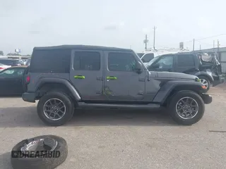2021 Jeep Wrangler Unlimited Sport S z VIN 1C4HJXDN6MW549686, wystawiony jako IAAI lot #42249816 z przebiegiem 64 911 mil mil oraz . Historia ofert i sprzedaży dostępna na DreamBid. Obrazek 13.