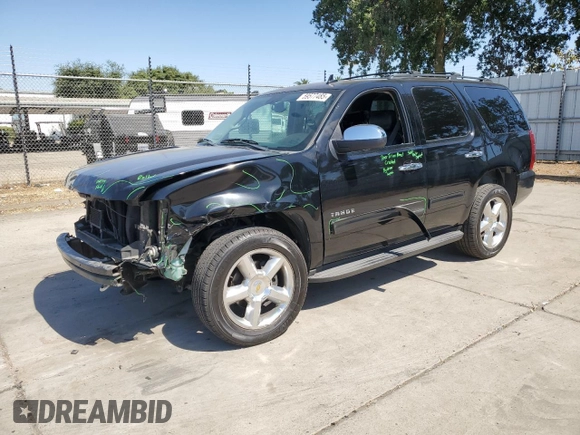2014 Chevrolet Tahoe LT with VIN 1GNSCBE07ER115998, listed as a Copart auction lot 59577485 with 154,486 mi miles and Salvage title. Bid and sale history available at DreamBid. Image 1.