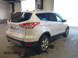 2016 Ford Escape Titanium with VIN 1FMCU9J94GUC28648, listed as a IAAI auction lot 42043761 with 82,509 mi miles and . Bid and sale history available at DreamBid. Image 4.