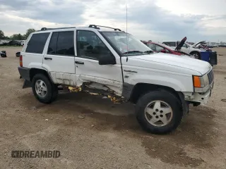 1995 Jeep Grand Cherokee Laredo z VIN 1J4GZ58S2SC578183, wystawiony jako Copart lot #61665955 z przebiegiem 341 135 mil mil oraz Szkoda całkowita • Salvage title. Historia ofert i sprzedaży dostępna na DreamBid. Obrazek 4.